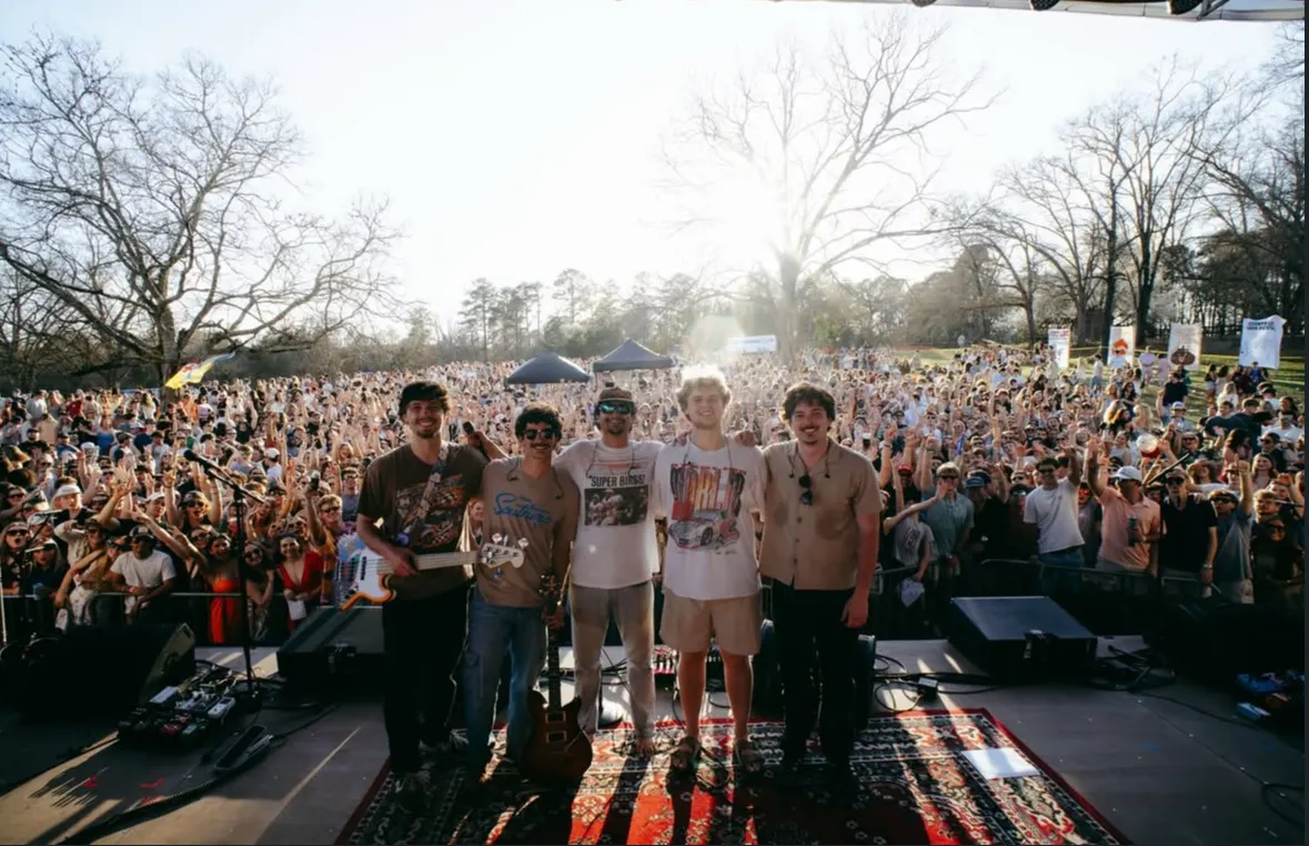 A band takes a bow in front of thousands of fans