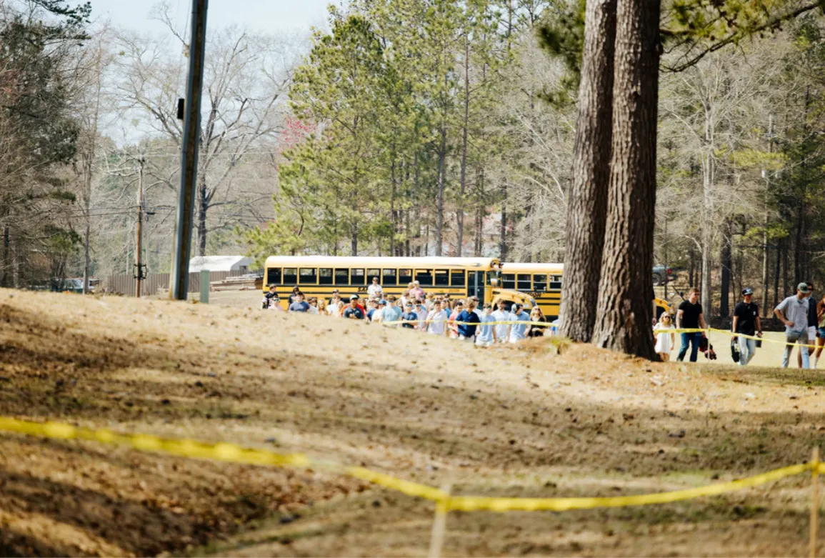 Festival-goers arriving across the farm grounds