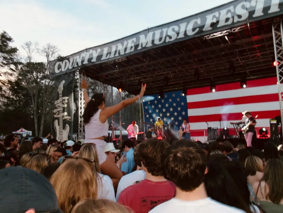 The County Line Music Fest stage banner above the crowd