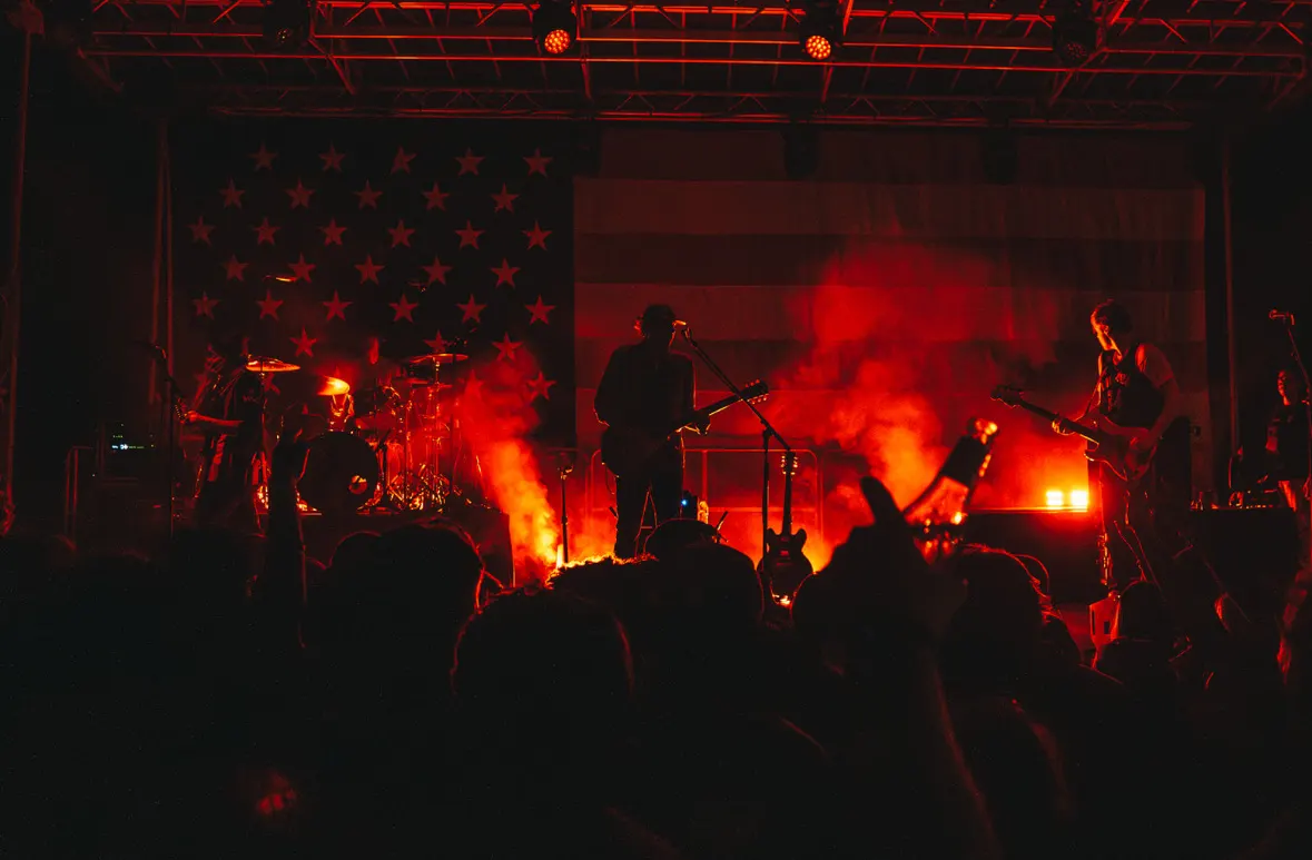 Red stage light and smoke during a night set